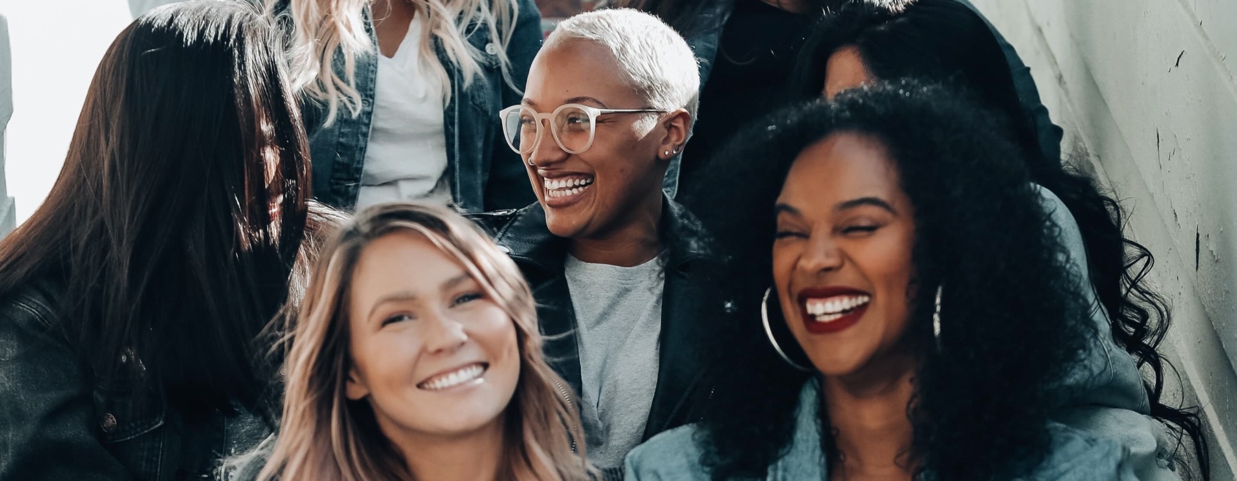 women smiling outdoors